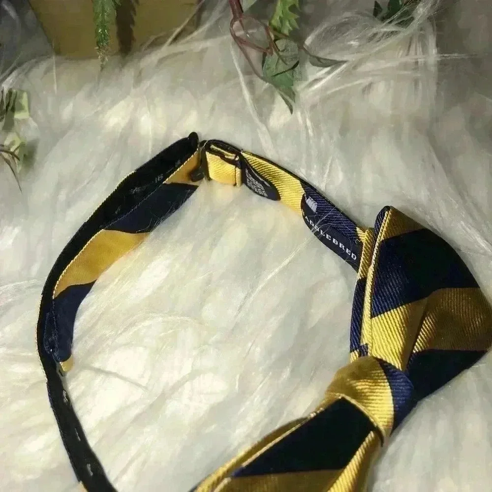 SADDLEBRED BOWTIE BLUE/GOLD